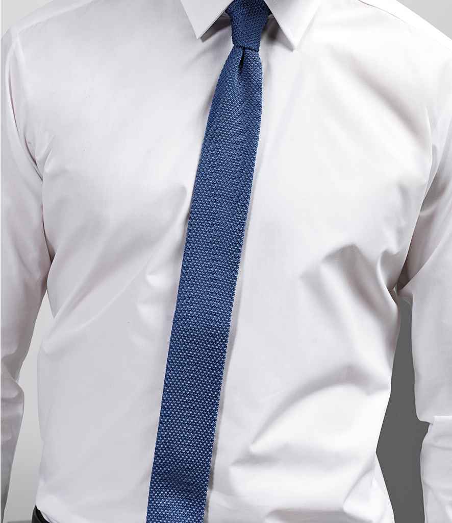 Premier Slim Knitted Tie in ONE Mid Blue by Premier — Custom branded clothing by Print Press, featuring premium embroidery produced in our specialist print lab in the UK.