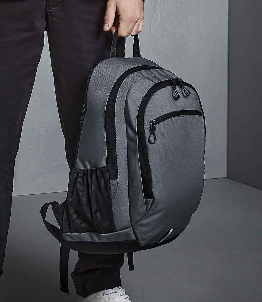 Quadra Endeavour Backpack in ONE Graphite Grey by Quadra — Custom branded clothing by Print Press, featuring premium embroidery produced in our specialist print lab in the UK.