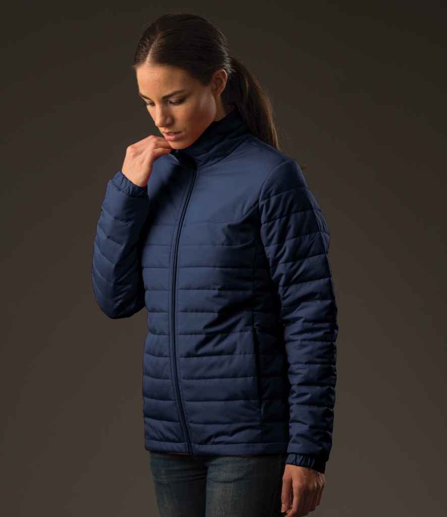 Stormtech Ladies Nautilus Quilted Jacket in Navy by Stormtech — Custom branded clothing by Print Press, featuring premium embroidery produced in our specialist print lab in the UK.