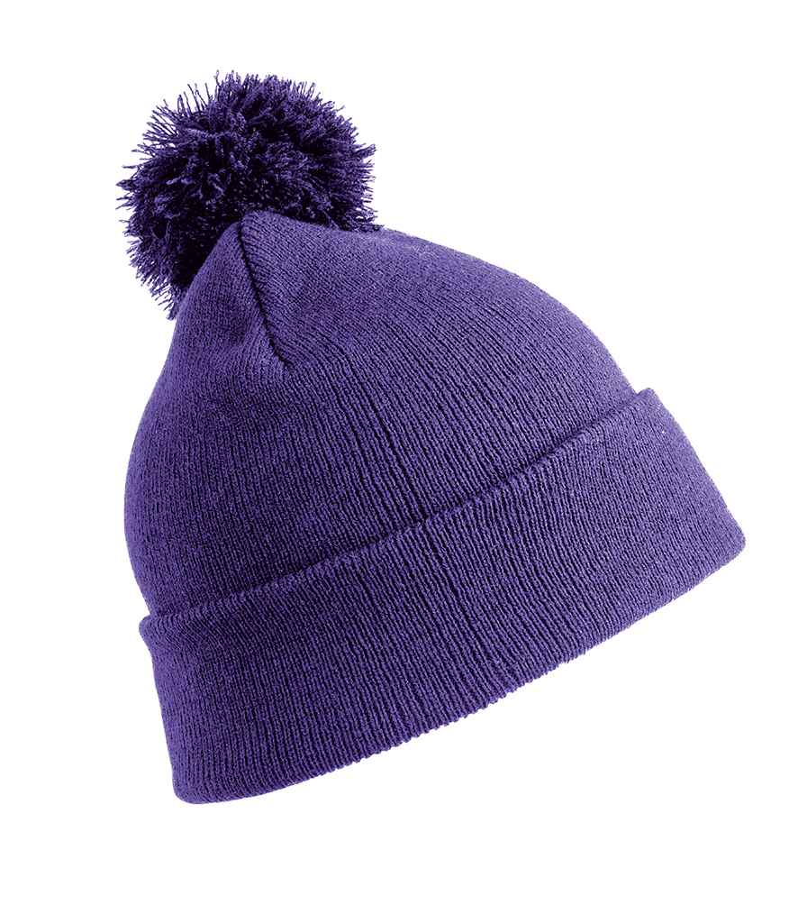 Result Core Kids Pom Pom Beanie in ONE Purple by Result Winter Essentials — Custom branded clothing by Print Press, featuring premium embroidery produced in our specialist print lab in the UK.