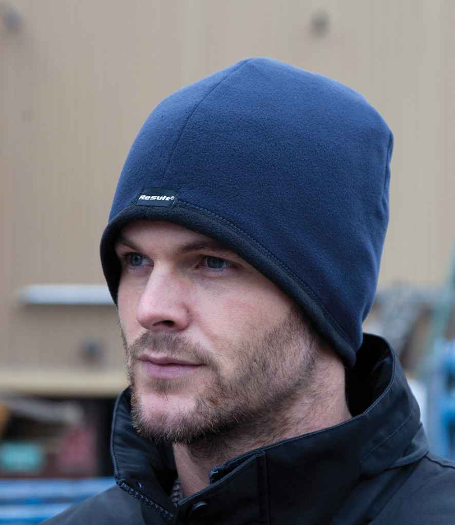 Result Reversible Micro Fleece Bob Hat in Black Navy by Result Winter Essentials — Custom branded clothing by Print Press, featuring premium embroidery produced in our specialist print lab in the UK.