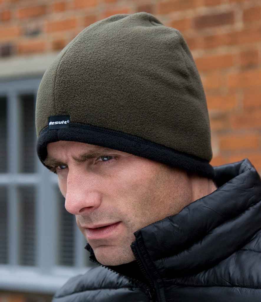 Result Reversible Micro Fleece Bob Hat in Olive Green Black by Result Winter Essentials — Custom branded clothing by Print Press, featuring premium embroidery produced in our specialist print lab in the UK.