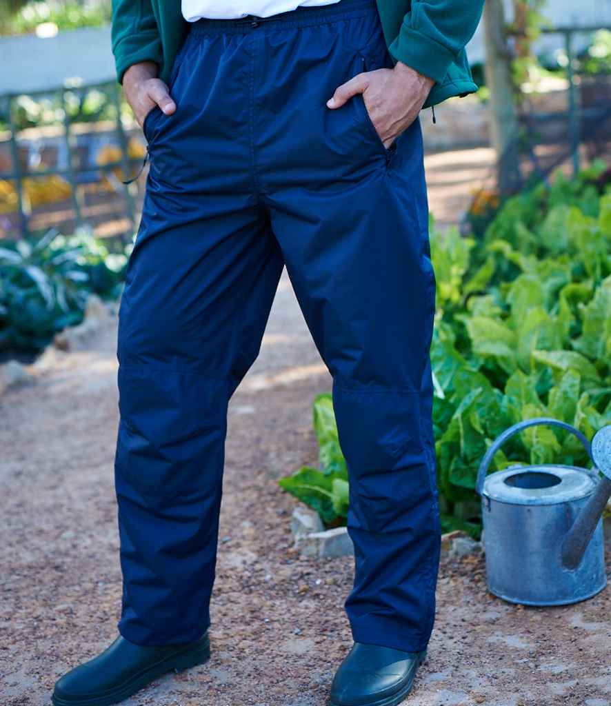 Regatta Linton Waterproof Overtrousers in R Navy by Regatta — Custom branded clothing by Print Press, featuring premium embroidery produced in our specialist print lab in the UK.