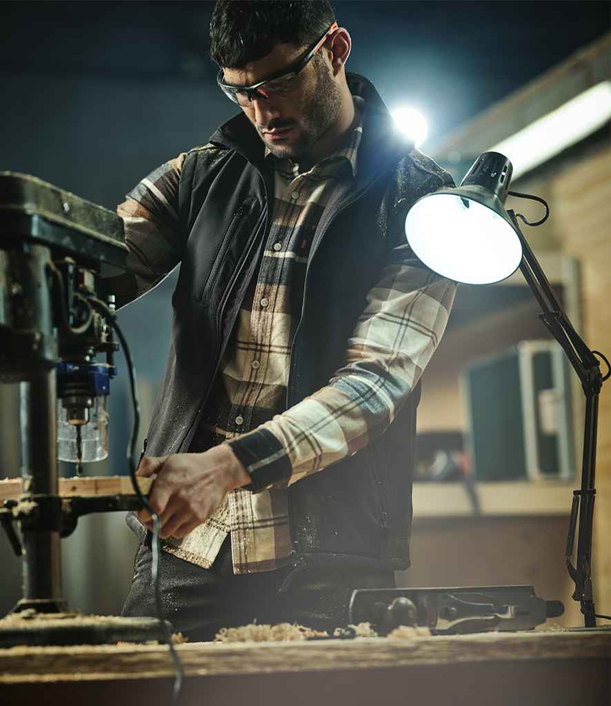 Regatta Sandstorm Workwear Soft Shell Bodywarmer in Black by Regatta — Custom branded clothing by Print Press, featuring premium embroidery produced in our specialist print lab in the UK.