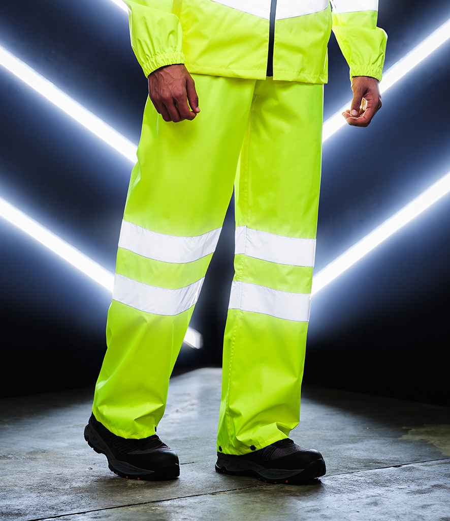 Regatta High Visibility Pro Packaway Overtrousers in by Regatta High Visibility — Custom branded clothing by Print Press, featuring premium embroidery produced in our specialist print lab in the UK.