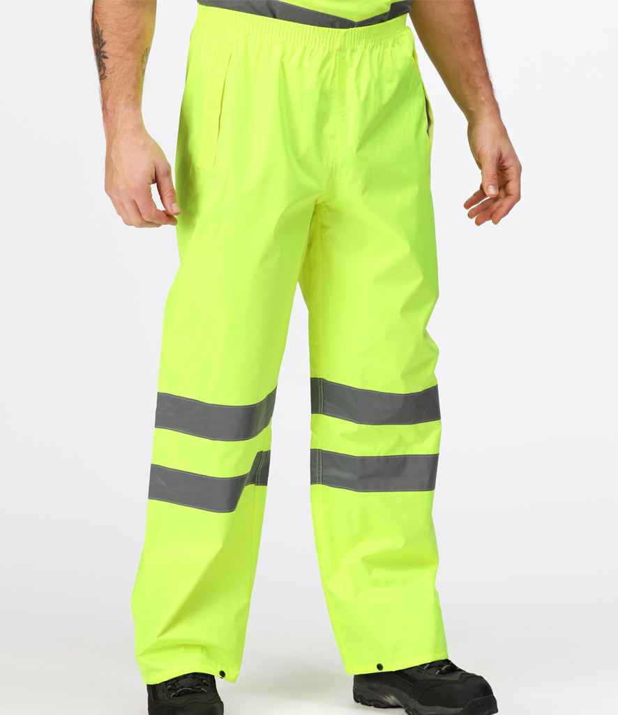 Regatta High Visibility Pro Packaway Overtrousers in by Regatta High Visibility — Custom branded clothing by Print Press, featuring premium embroidery produced in our specialist print lab in the UK.