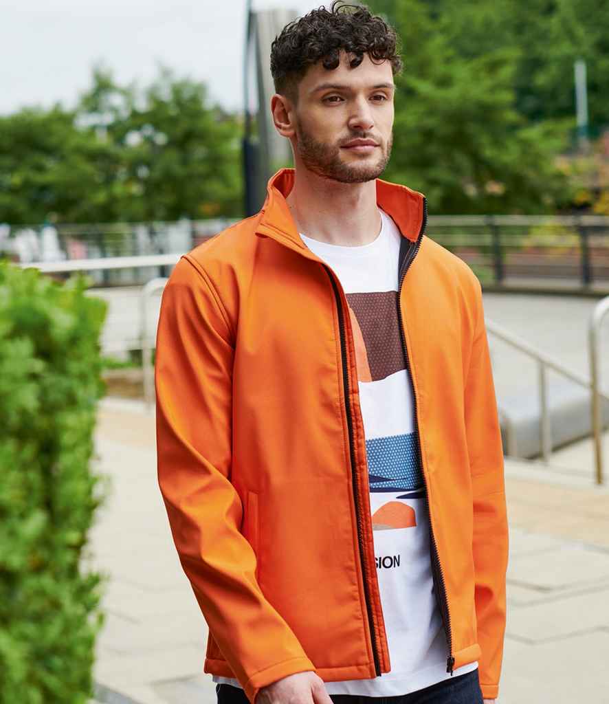 Regatta Ablaze Printable Soft Shell Jacket in Magma Orange Black by Regatta — Custom branded clothing by Print Press, featuring premium embroidery produced in our specialist print lab in the UK.