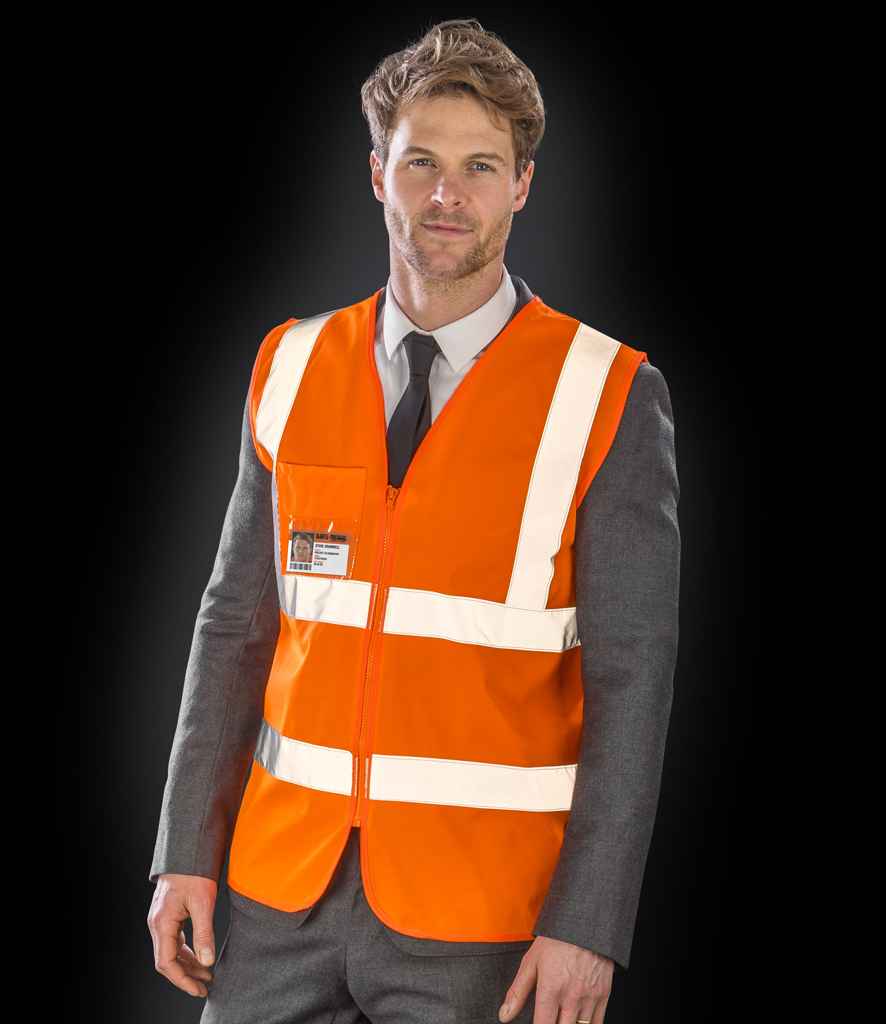 Result Core Zip Safety Tabard in Fluorescent Orange by Result Core — Custom branded clothing by Print Press, featuring premium embroidery produced in our specialist print lab in the UK.