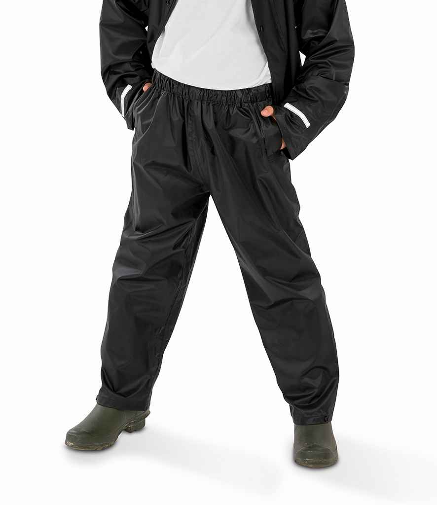 Result Core Kids Waterproof Overtrousers in Black by Result Core — Custom branded clothing by Print Press, featuring premium embroidery produced in our specialist print lab in the UK.