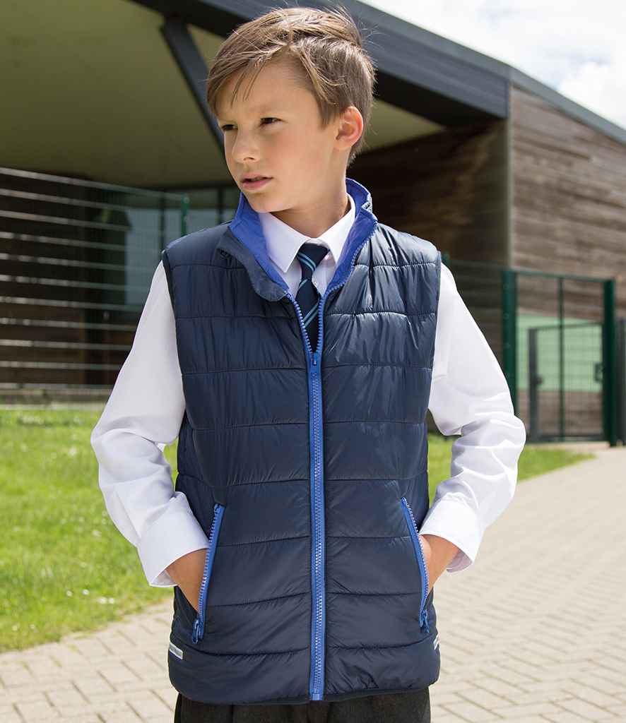 Result Core Kids Padded Bodywarmer in by Result Core — Custom branded clothing by Print Press, featuring premium embroidery produced in our specialist print lab in the UK.