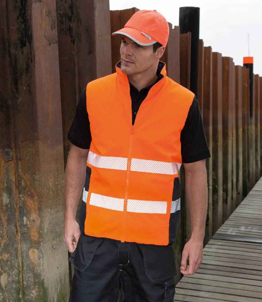 Result Safe-Guard Reversible Soft Padded Gilet in Fluorescent Orange Navy by Result Safe-Guard — Custom branded clothing by Print Press, featuring premium embroidery produced in our specialist print lab in the UK.