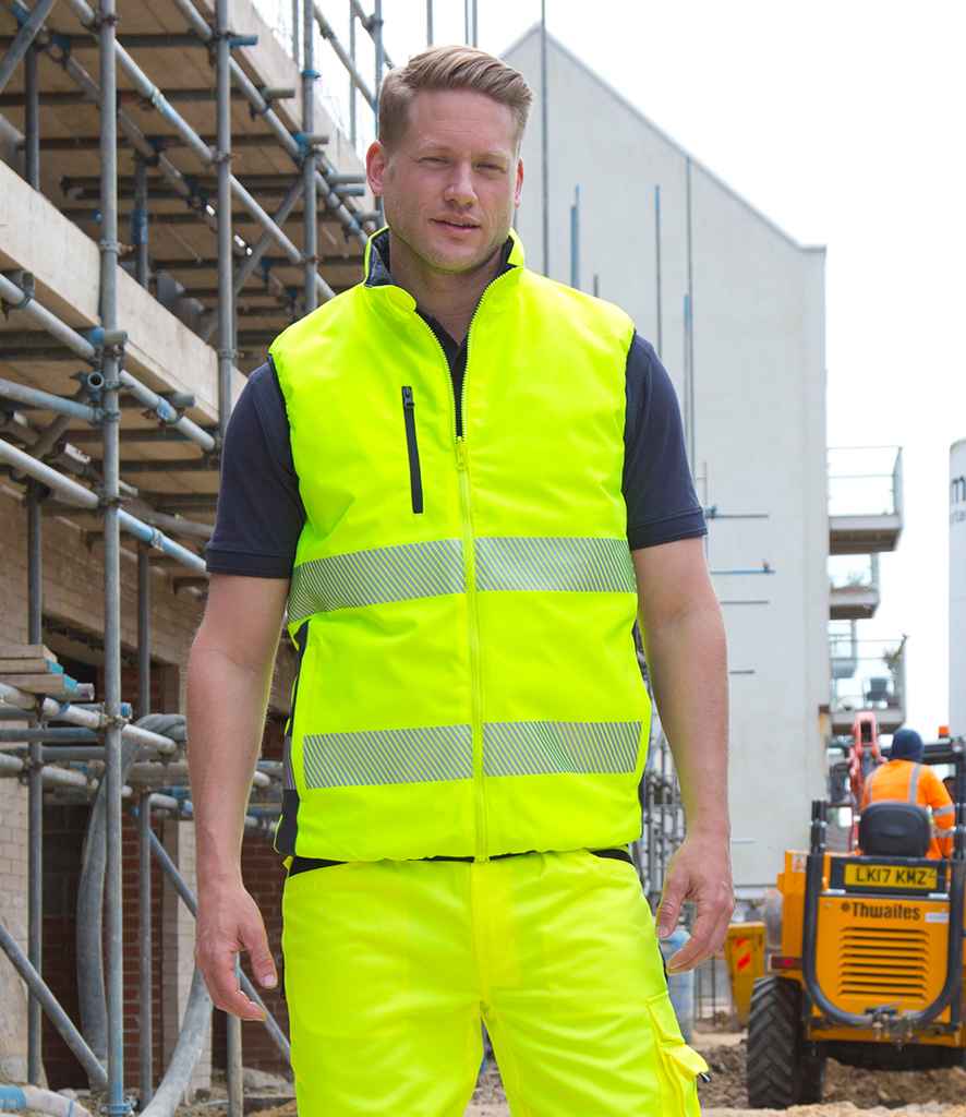 Result Safe-Guard Reversible Soft Padded Gilet in Fluorescent Yellow Navy by Result Safe-Guard — Custom branded clothing by Print Press, featuring premium embroidery produced in our specialist print lab in the UK.