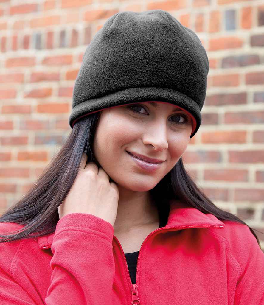 Result Reversible Fleece Skull Hat in ONE Black Red by Result Winter Essentials — Custom branded clothing by Print Press, featuring premium embroidery produced in our specialist print lab in the UK.