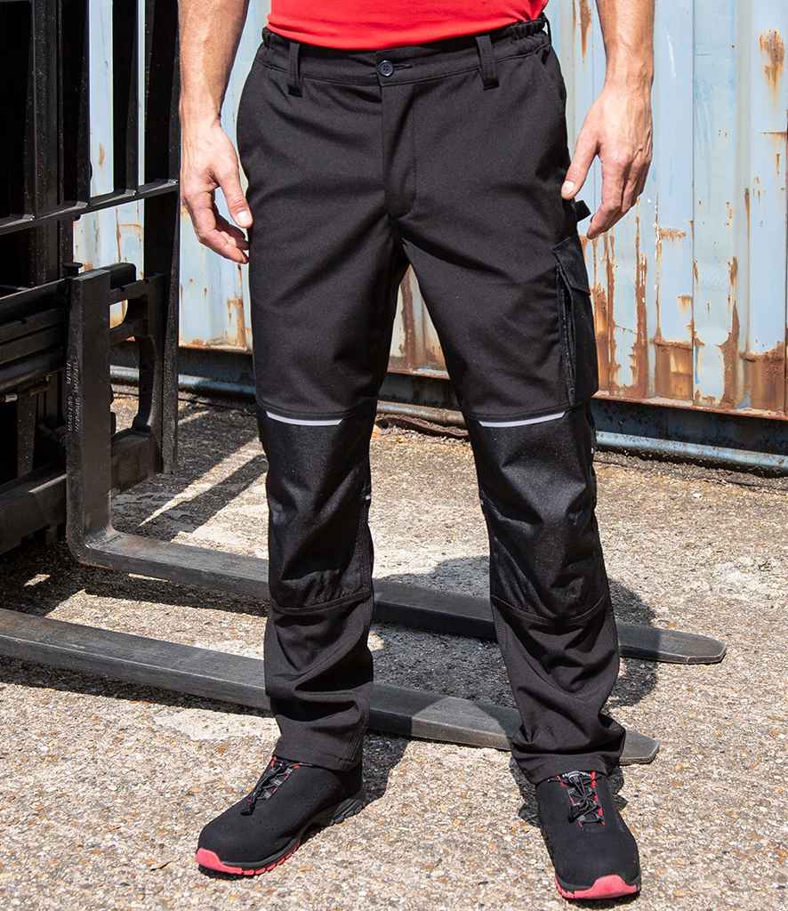 Result Work-Guard Slim Fit Soft Shell Trousers in Black by Result Work-Guard — Custom branded clothing by Print Press, featuring premium embroidery produced in our specialist print lab in the UK.