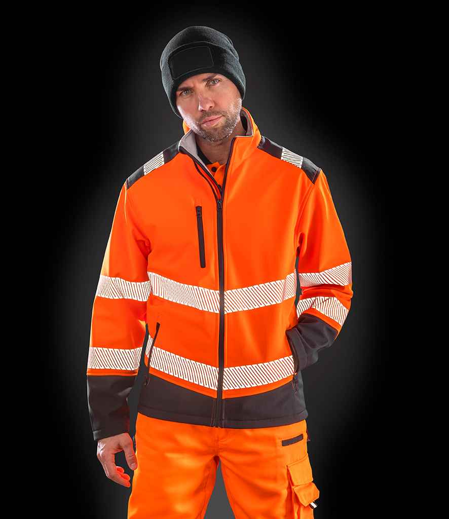 Result Safe-Guard Printable Ripstop Safety Soft Shell Jacket in Fluorescent Orange Black by Result Safe-Guard — Custom branded clothing by Print Press, featuring premium embroidery produced in our specialist print lab in the UK.