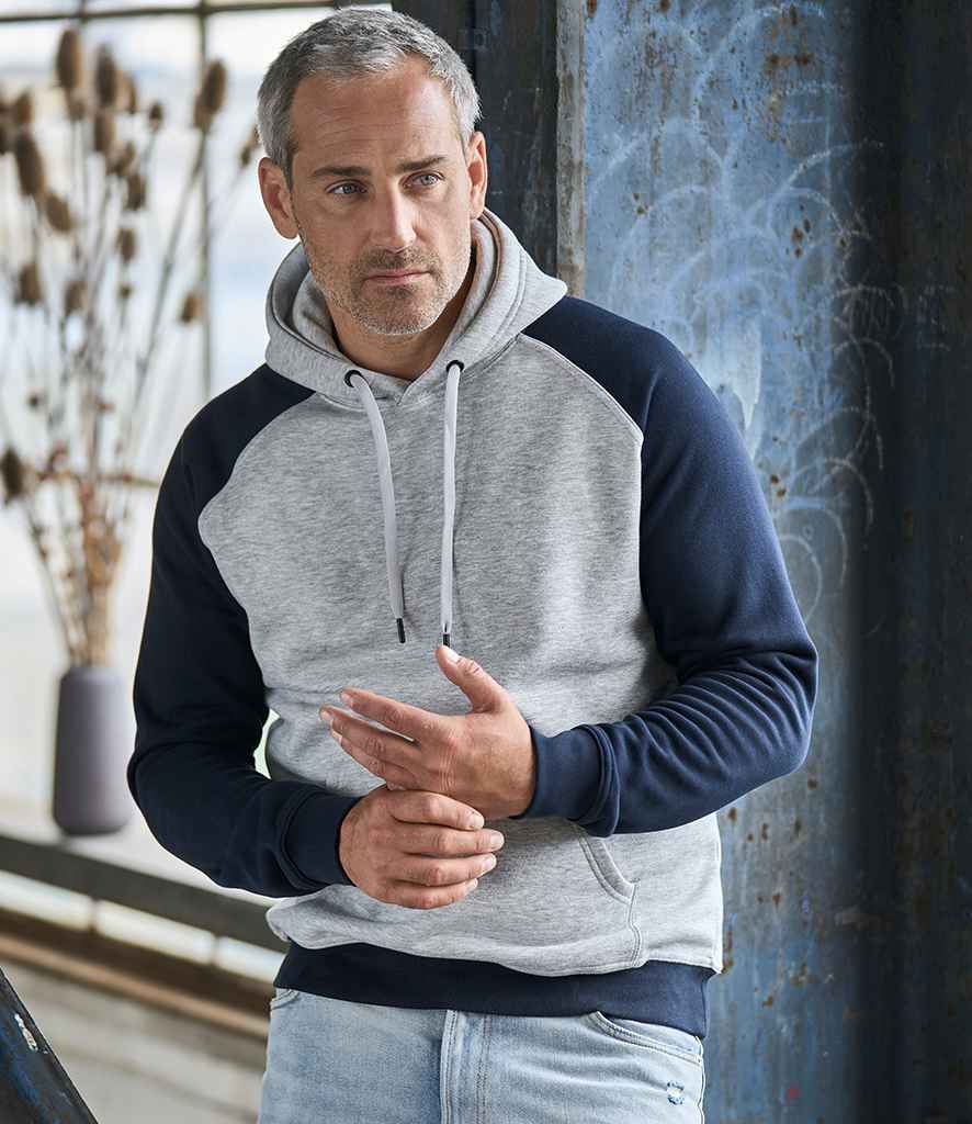 Tee Jays Two Tone Raglan Hooded Sweatshirt in Heather Grey Navy by Tee Jays — Custom branded clothing by Print Press, featuring premium embroidery produced in our specialist print lab in the UK.