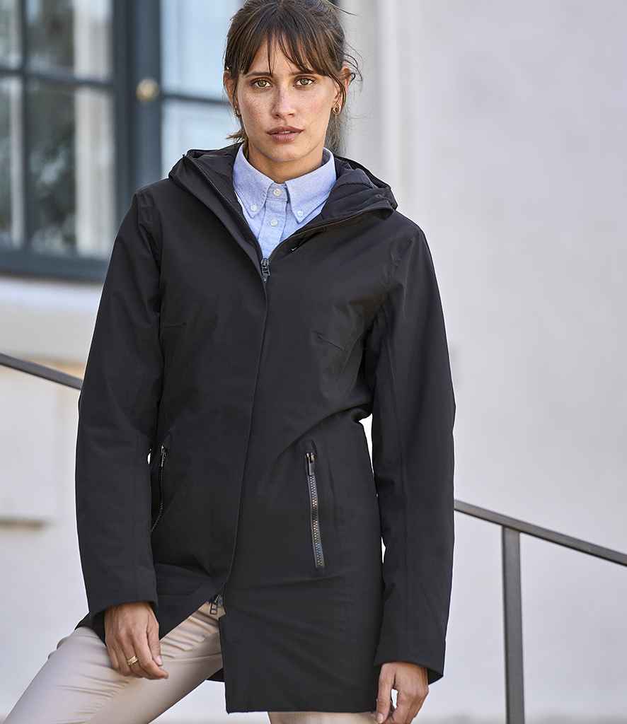 Tee Jays Ladies All Weather Parka Jacket in Black by Tee Jays — Custom branded clothing by Print Press, featuring premium embroidery produced in our specialist print lab in the UK.