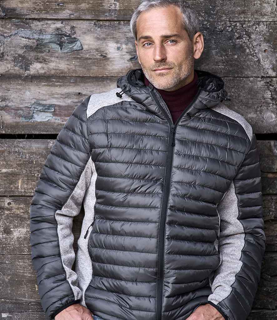 Tee Jays Crossover Hooded Padded Outdoor Jacket in Space Grey Grey Melange by Tee Jays — Custom branded clothing by Print Press, featuring premium embroidery produced in our specialist print lab in the UK.
