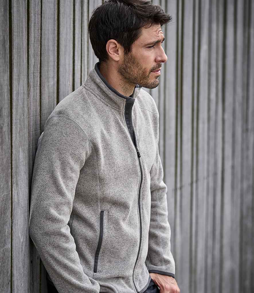 Tee Jays Knitted Outdoor Fleece Jacket in Grey Melange by Tee Jays — Custom branded clothing by Print Press, featuring premium embroidery produced in our specialist print lab in the UK.