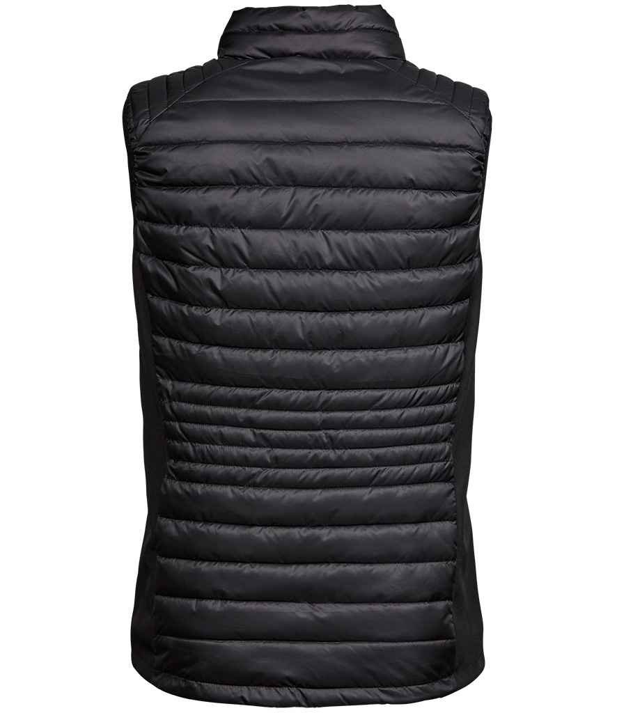 Tee Jays Ladies Crossover Padded Bodywarmer in by Tee Jays — Custom branded clothing by Print Press, featuring premium embroidery produced in our specialist print lab in the UK.