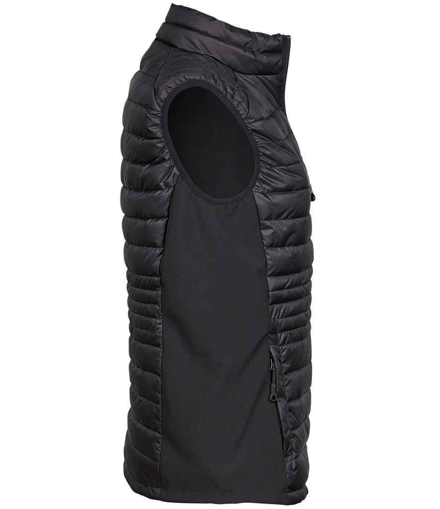Tee Jays Ladies Crossover Padded Bodywarmer in by Tee Jays — Custom branded clothing by Print Press, featuring premium embroidery produced in our specialist print lab in the UK.