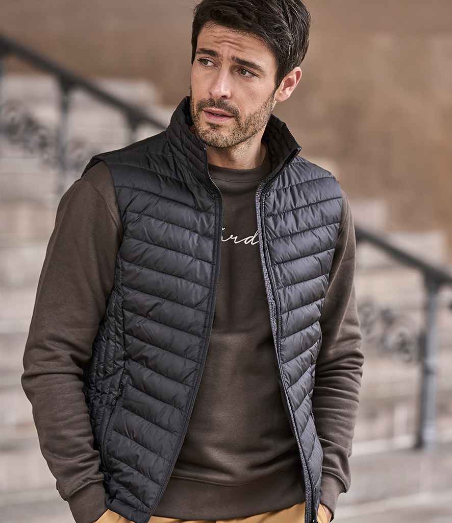 Tee Jays Zepelin Padded Bodywarmer in Black by Tee Jays — Custom branded clothing by Print Press, featuring premium embroidery produced in our specialist print lab in the UK.
