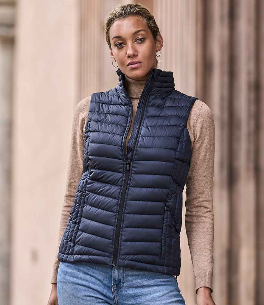 Tee Jays Ladies Zepelin Padded Bodywarmer in Deep Navy by Tee Jays — Custom branded clothing by Print Press, featuring premium embroidery produced in our specialist print lab in the UK.