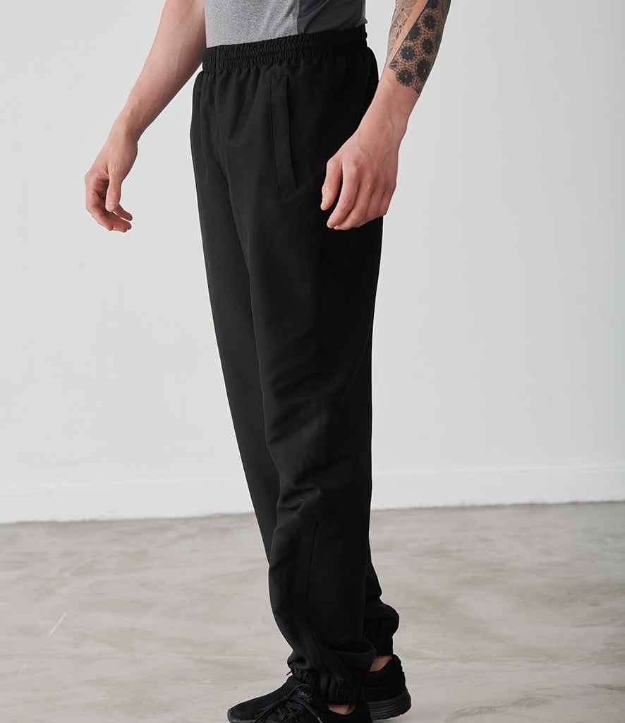 Tombo Cuffed Track Pants in Black by Tombo — Custom branded clothing by Print Press, featuring premium embroidery produced in our specialist print lab in the UK.
