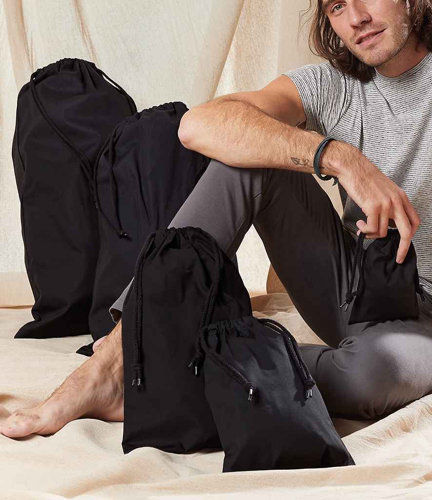 Westford Mill Premium Cotton Stuff Bag in Black by Westford Mill — Custom branded clothing by Print Press, featuring premium embroidery produced in our specialist print lab in the UK.