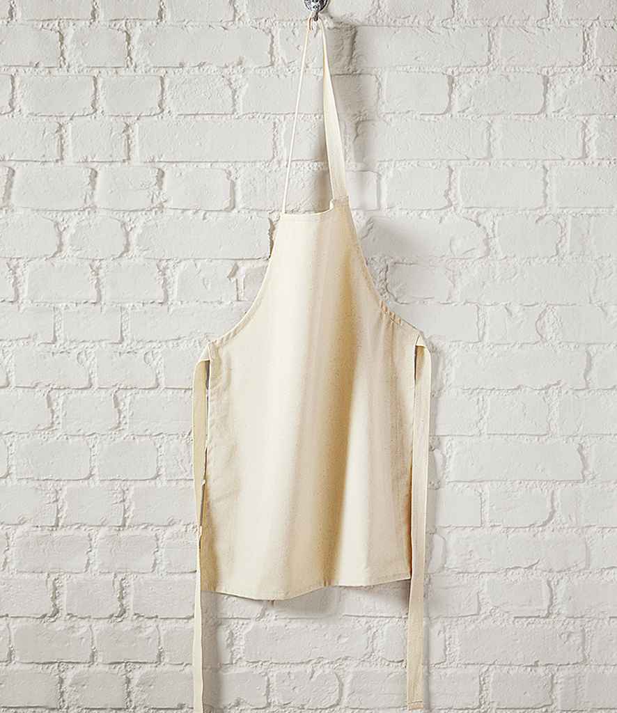 Westford Mill Fairtrade Kids Craft Apron in ONE Natural by Westford Mill — Custom branded clothing by Print Press, featuring premium embroidery produced in our specialist print lab in the UK.